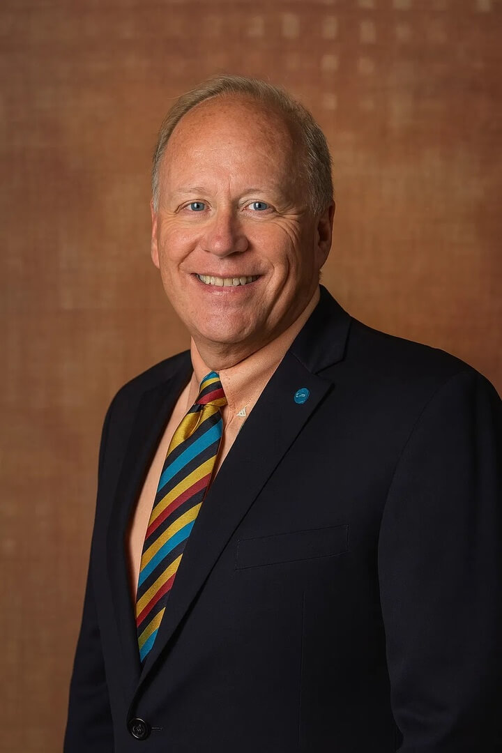 business owner David Frazee in a professional headshot with a colorful striped tie.