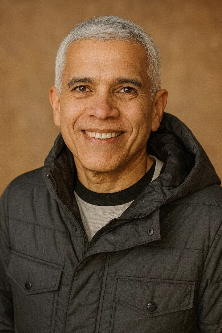 business owner Joel Merino Alcolea in a casual jacket, smiling warmly.
