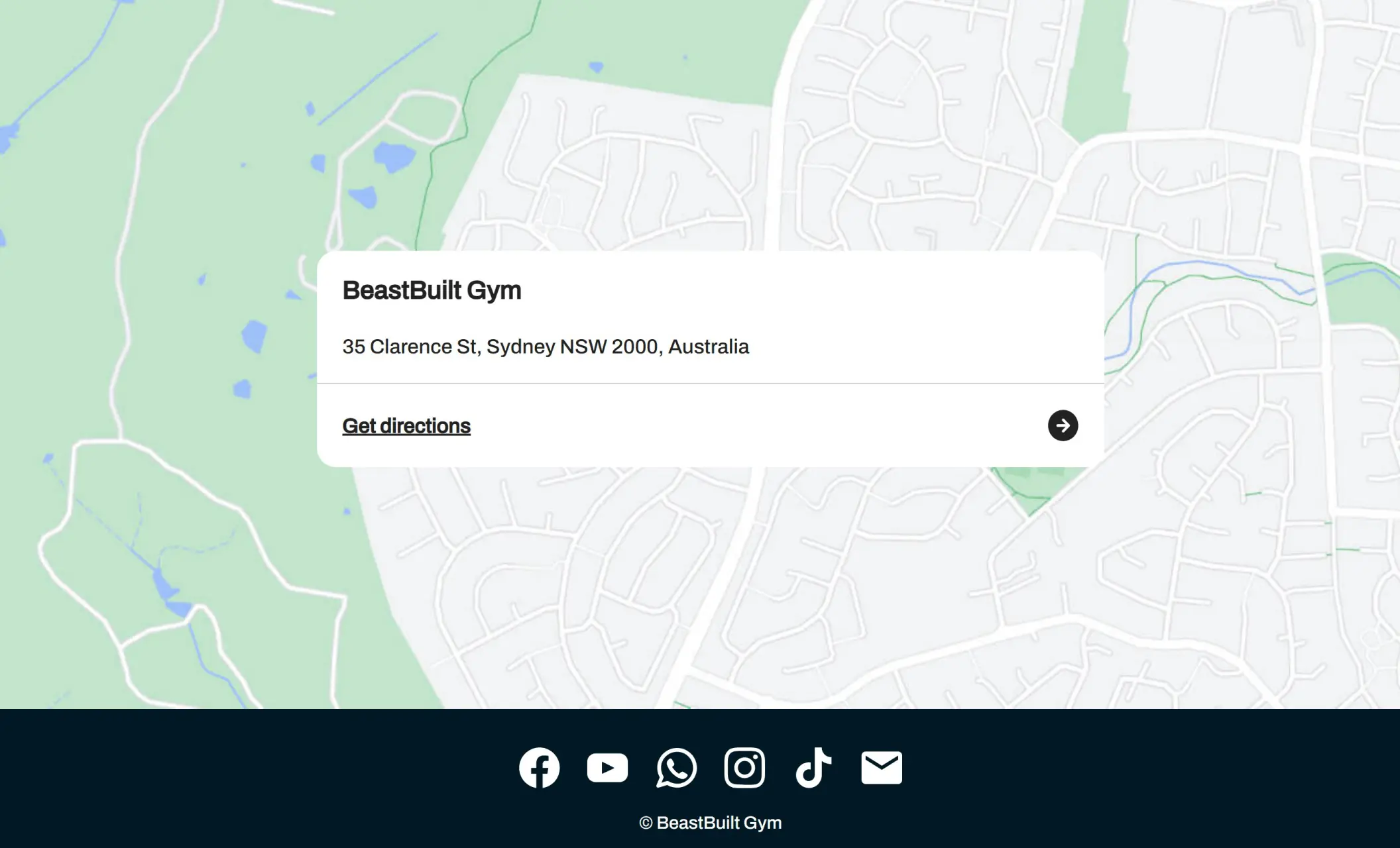 BeastBuilt Gym's website displaying a contact form, and social media links