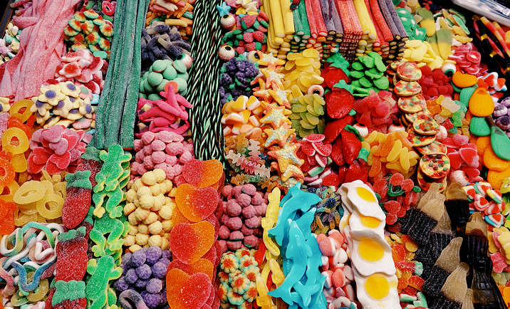 A variety of candies laid out in a candy store.