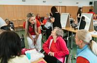 A caregiver talking to a woman.