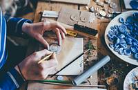 A person crafting molds.