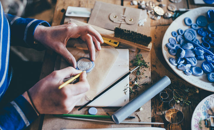 A person crafting molds.