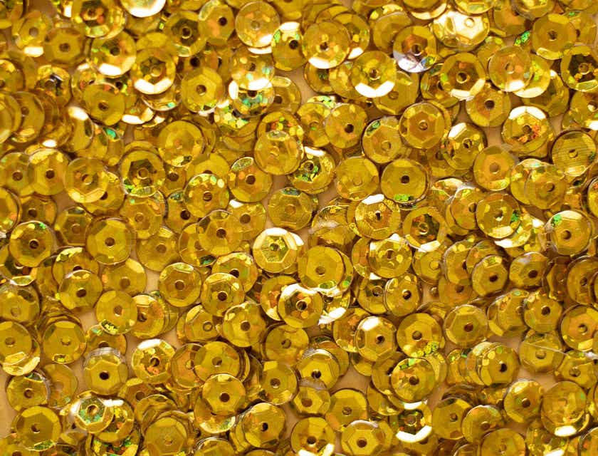Tante paillettes dorate viste da vicino.
