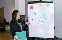 An executive presenting statistics relating to a company's brand identity.