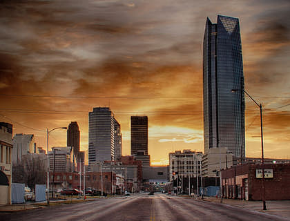 Downtown oklahoma city businesses at dusk.