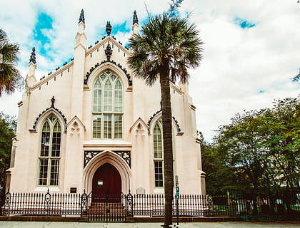 The historical French Protestant Church with two palm trees in Charleston, South Carolina