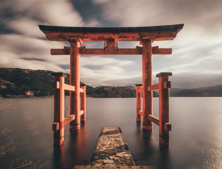 A Japanese torii gate in a lake.