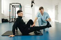 A physical therapist working with a patient.