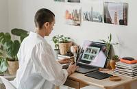 A photographer updating their images for their online portfolio.