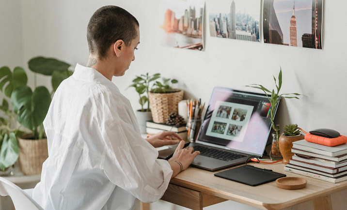 A photographer updating their images for their online portfolio.