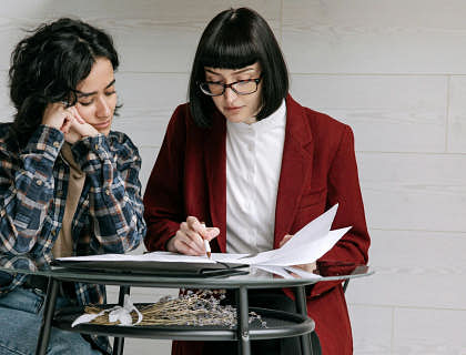 Women reviewing a DBA application.