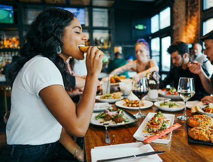 A group of people enjoying a meal at a restaurant.