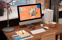 A simple desk setup with a unique website displayed on the computer screen.