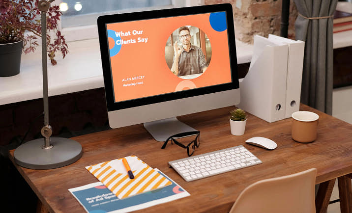 A simple desk setup with a unique website displayed on the computer screen.