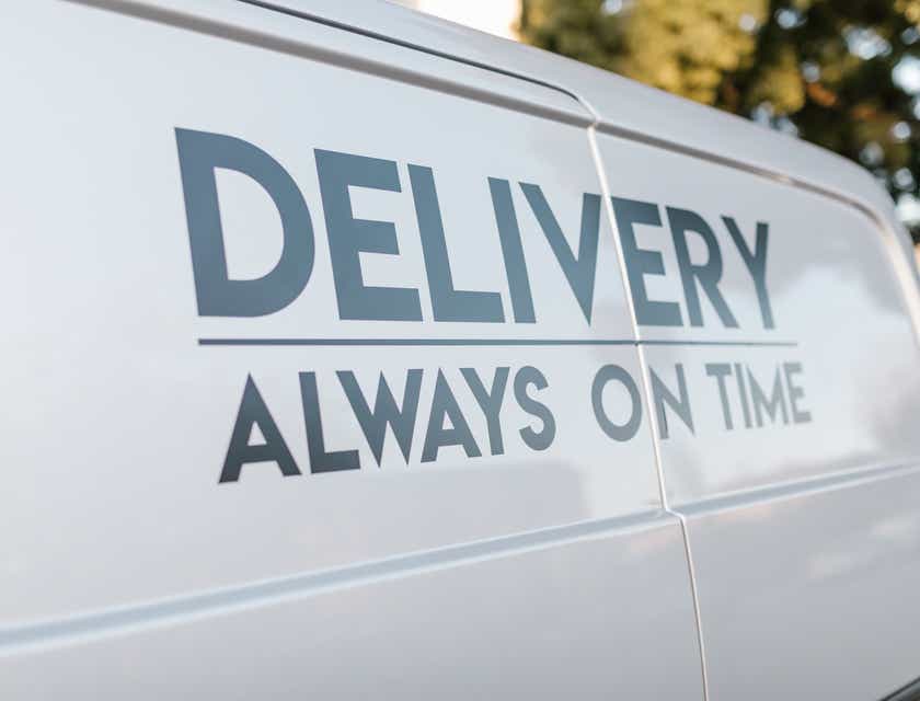A delivery van displaying the business's slogan.