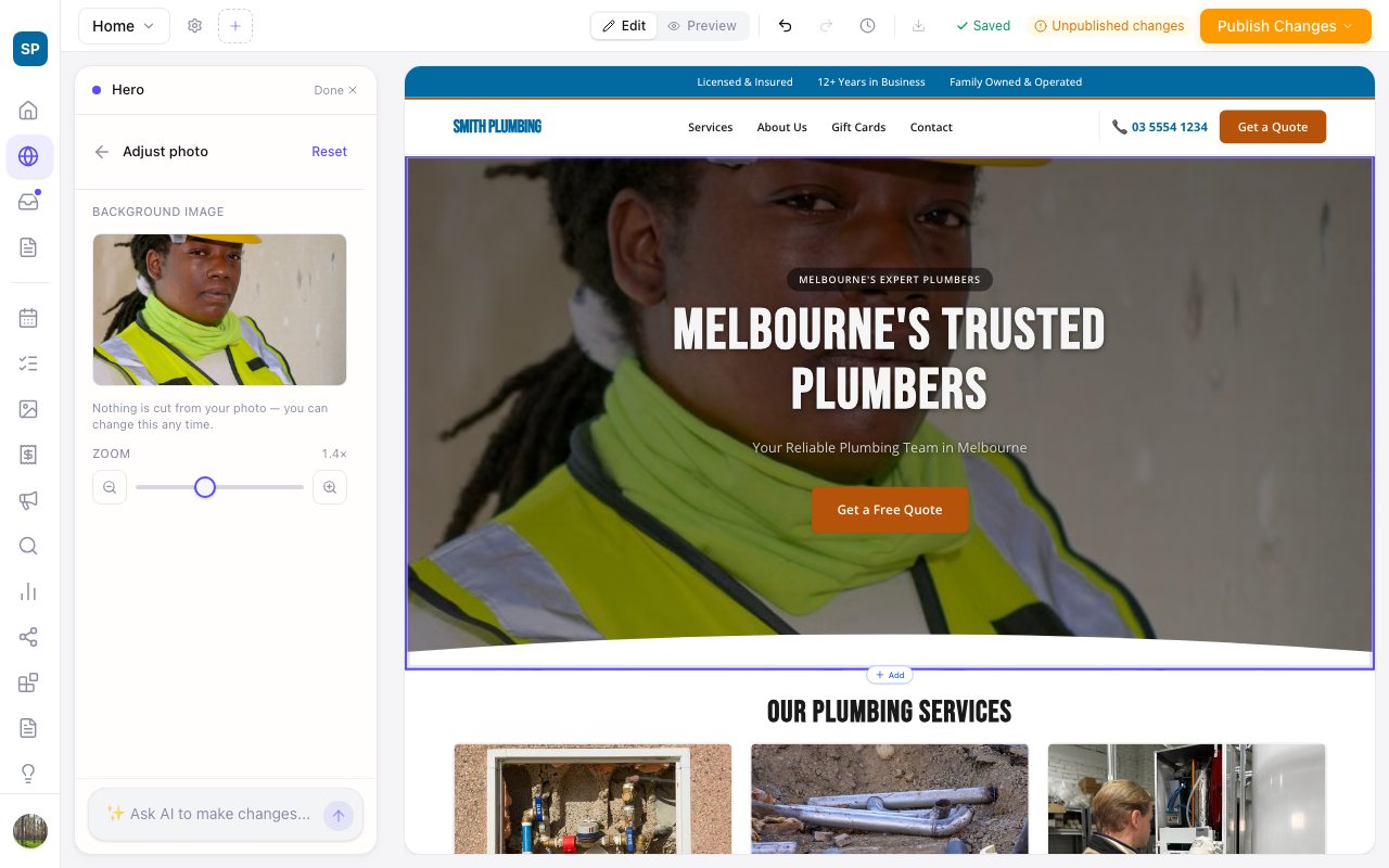 The Zarla editor with a full-width hero photo open in Adjust: the zoom slider set to 1.4 times, the photo pulled in around the plumber's face, and the same closer crop showing behind the headline on the site canvas.
